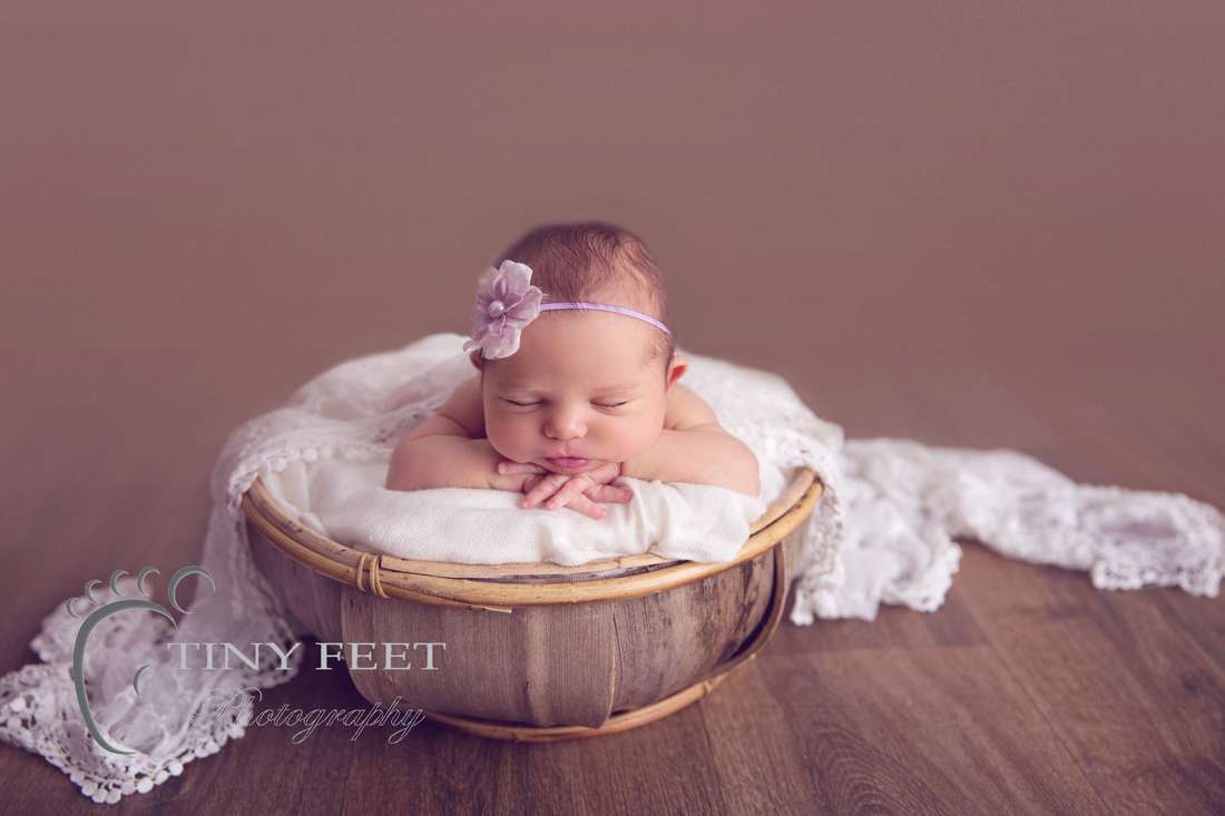 Tiny Feet Photography baby girl posed in coconut bowl on tummy