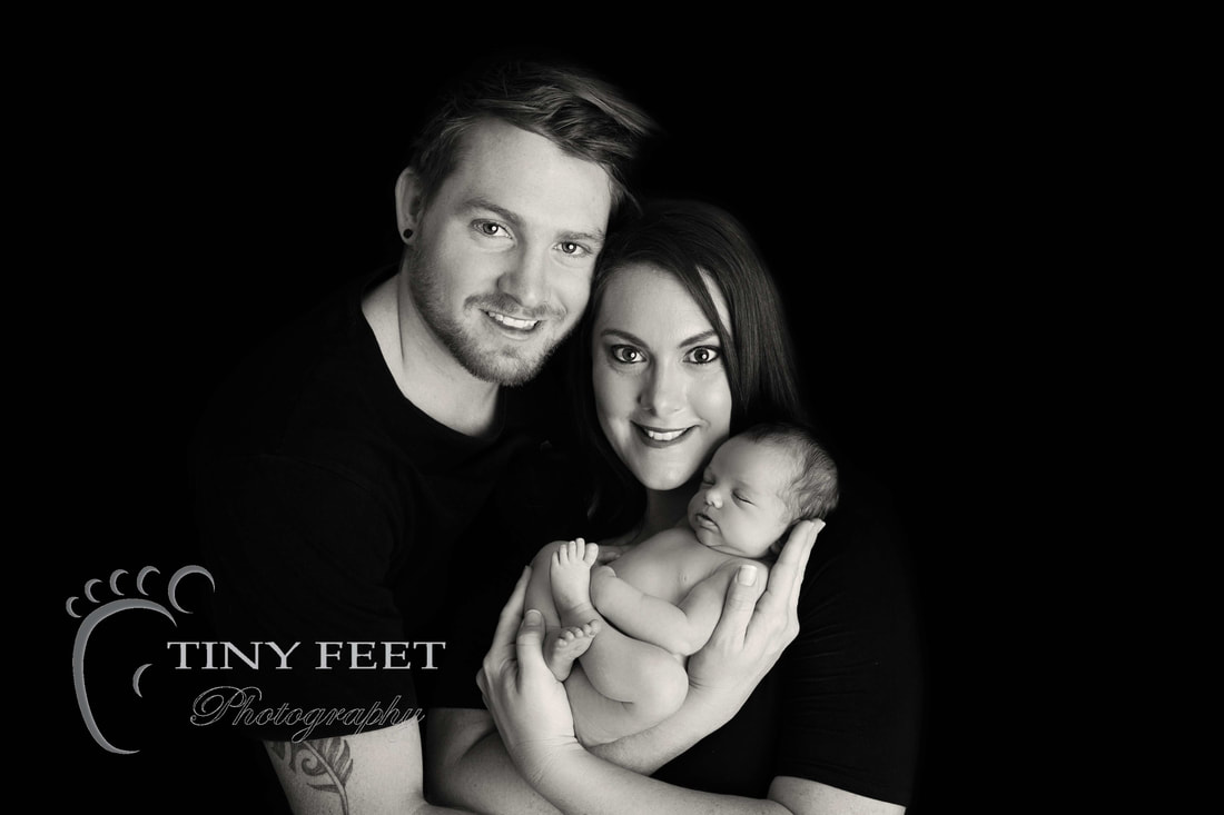 Tiny Feet Photography black and white image posed with mum and dad