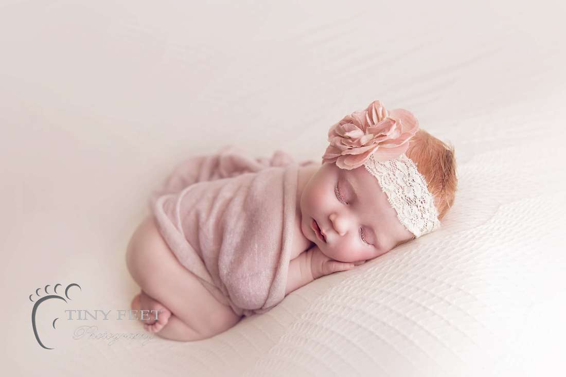 Tiny Feet Photography Baby girls posed on white blanket