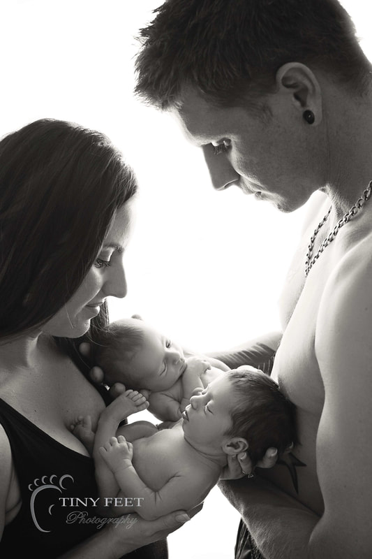 Tiny Feet Photography newborn twin posed with parents