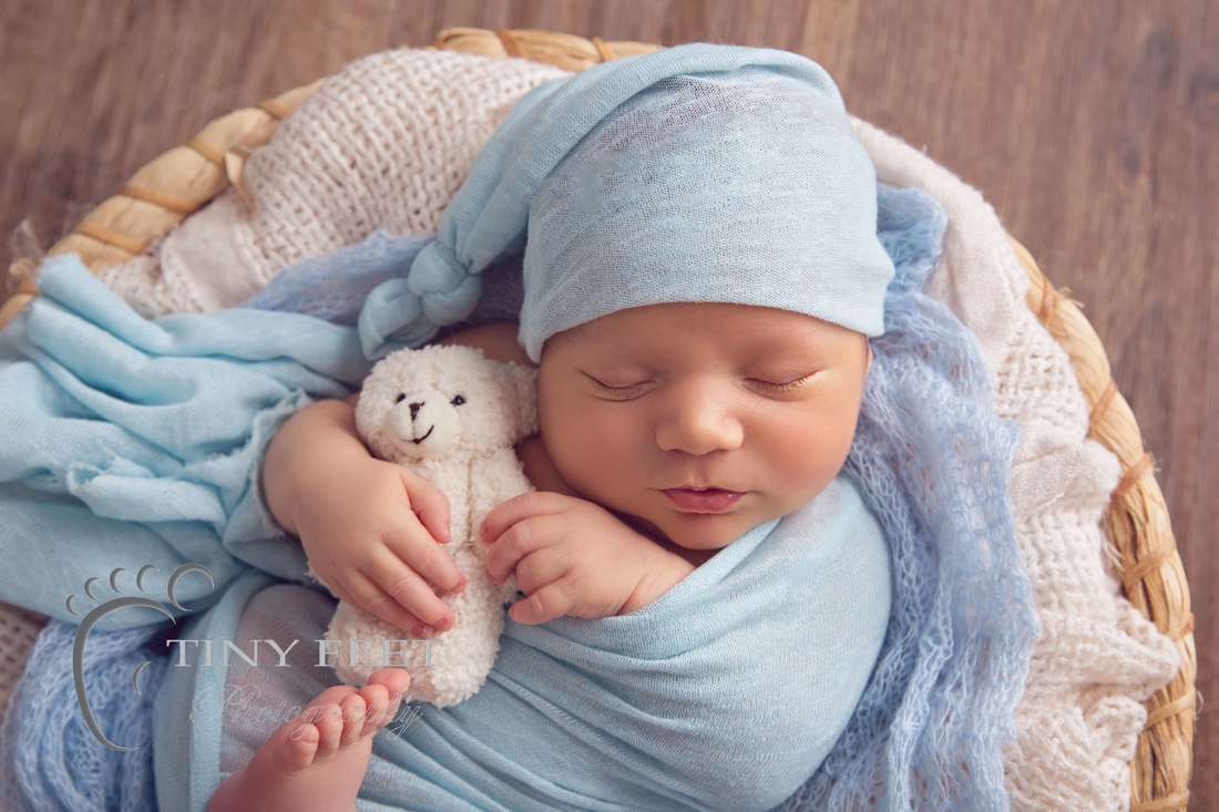 Tiny Feet Photography newborn baby boy wrapped in blue posed in bowl