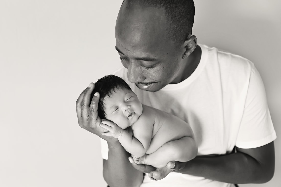 Black and White baby girl posed with dad