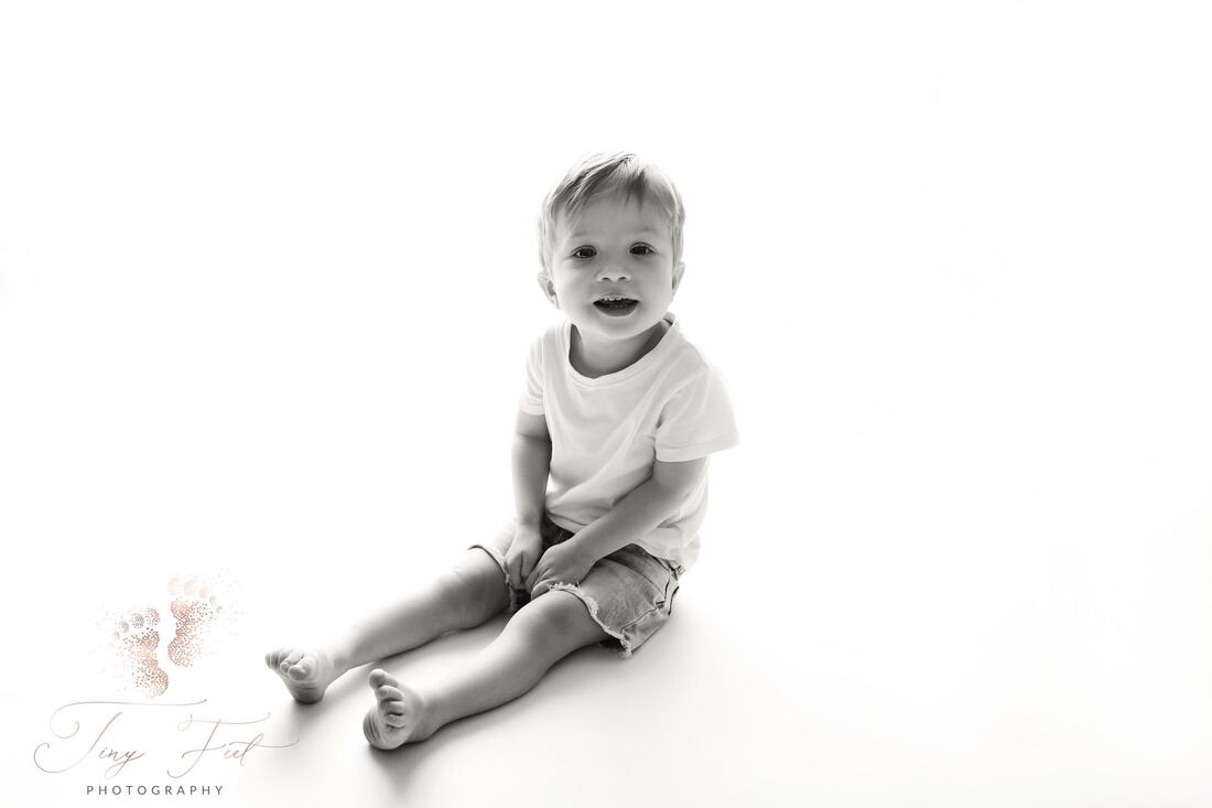 Tiny Feet Photography Black and white back lit studio child portrait image