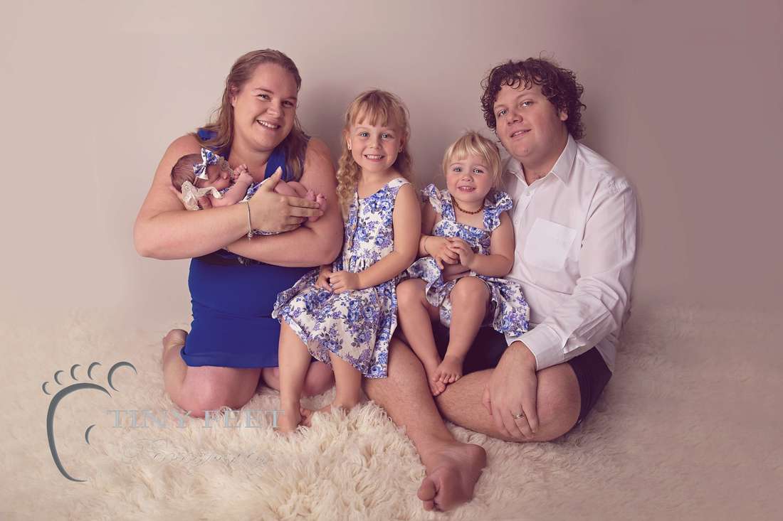 Tiny Feet Photography Family of 5 posing with newborn