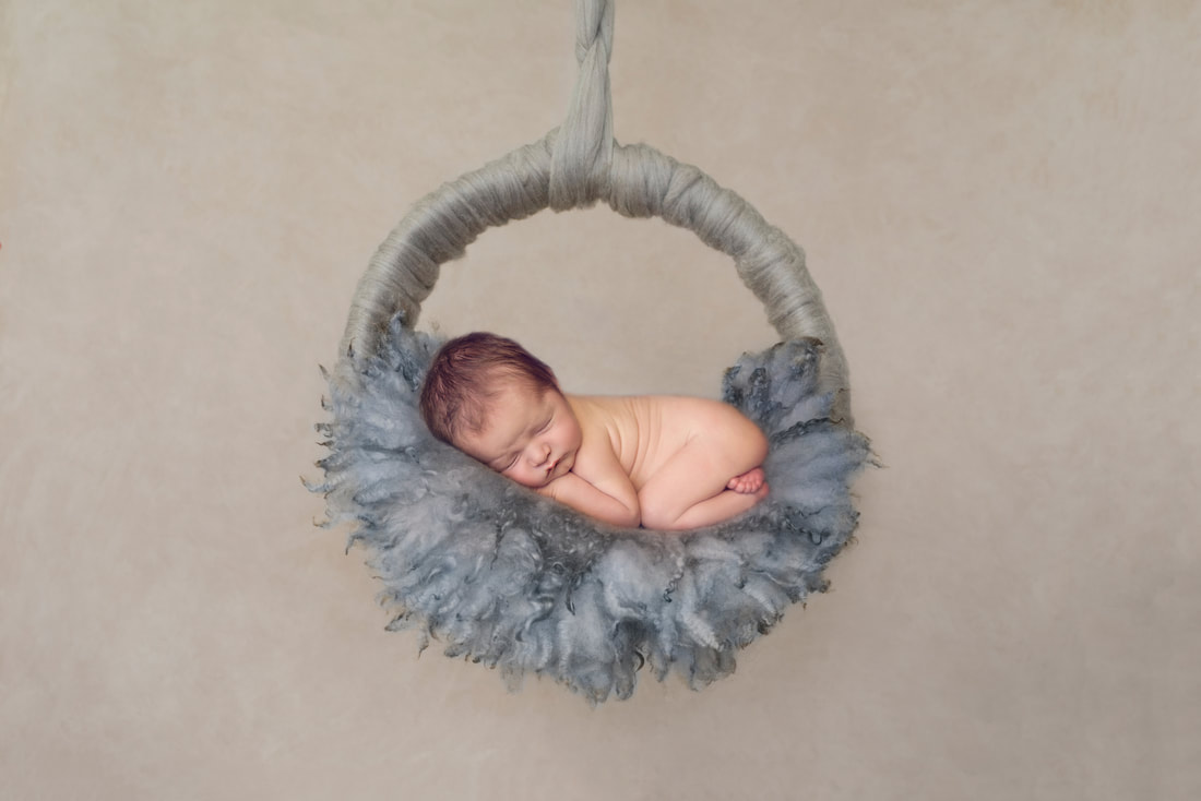 Tiny Feet Photography Newborn baby boy composite image on Luisa Dunn Hanging Basket with grey